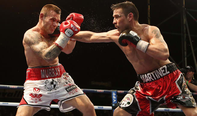 Despite rain and Martin Murray's fists, Sergio Martinez held on to his WBC middleweight title.